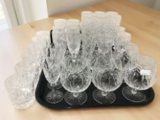 Several sets of drinking glasses including champagne flutes, tumblers, rummers, etc.