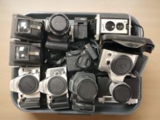 A group of camera bodies including two Minolta 404SI Dynax cameras, a further Minolta 505SI Dynax,