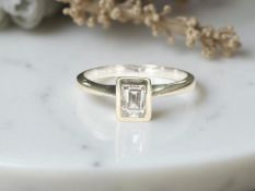 An 18ct white gold Millenium diamond ring, approximately 0.6ct, size R.