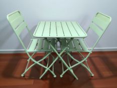 A contemporary metal folding garden table and pair of chairs.
