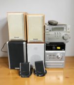 A Panasonic hi-fi and several pairs of speakers.