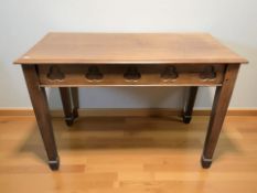 A stained pine ecclesiastical table, 121 cm x 59 cm x 85 cm.