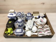 A group of Ringtons porcelain including caddies, tea pots, tin model car,