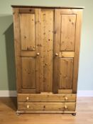 A modern pine wardrobe, 107 cm x 57 cm x 188 cm.