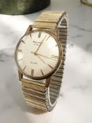 A gent's 9ct gold Rotary wristwatch on plated expanding strap, case 33mm (lacks crown,