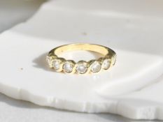 An 18ct gold diamond half eternity ring, approximately 0.45 carat.