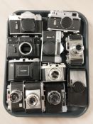 A group of camera bodies including Soviet examples, Zenit B, Zenit 11 and Zenit E cameras,