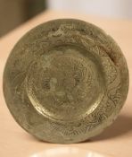 An oriental engraved brass plate, diameter 31 cm.