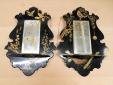 A pair of early 20th century Japanned mirrored wall shelves, each 44 cm high.