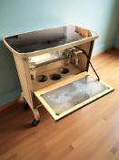 A small 1960's drinks table with fall front, width 55 cm.