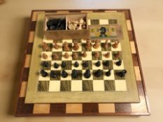 Two chessboards, a set of HPG stained boxwood chess pieces in box, kings 7.