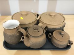 A group of Denby pottery tablewares including two lidded tureens and a three piece tea service.