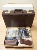 A briefcase and several pairs of glasses.