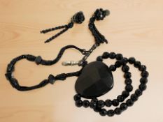 A Whitby Jet watch chain, earrings and bracelet.