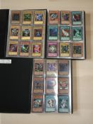 Three Yu-Gi-Oh! trading card albums and contents.
