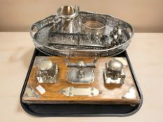 An early 20th century oak and EPNS desk stand, with pair of ink wells,