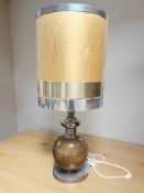 A contemporary chrome and ceramic table lamp with shade, height 98 cm.