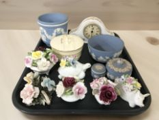 A group of Royal Doulton porcelain flower posies, an Aynsley mantel timepiece,