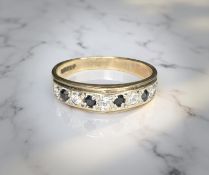 A 9ct gold sapphire and diamond half-eternity ring, size M CONDITION REPORT: 2.