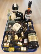 Assorted bottles of alcohol and miniatures including Lamb's Navy rum, Three Barrels French brandy,