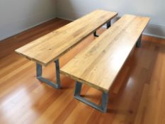 A pair of industrial style metal and oak topped rectangular benches, each 180 cm x 40 cm x 46 cm.