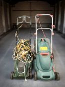 Two electric lawn mowers.