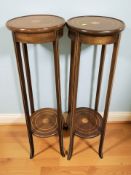 A pair of reproduction mahogany and satinwood inlaid two tier plant stands, height 99 cm.