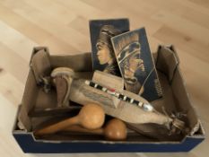 A group of African wooden items including headrest, two portrait panels, etc.
