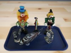 Three Murano glass clowns, a fish ornament,