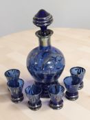 A blue and silvered glass decanter, height 22 cm, and matching set of six glasses.
