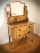 An Art Nouveau oak two drawer mirror back dressing chest, 92 cm x 45 cm x 150 cm.