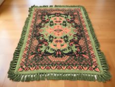 A Bokhara Suzani-style tasseled throw, 215 cm x 162 cm.