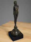A bronzed Art Deco style figure of a nude lady, height 31 cm.