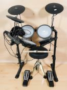A Donner electronic drum kit, with manual, pair of drumsticks, headphones and leads.
