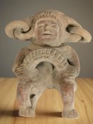 A Mexican folk art terracotta sculpture of a Mayan god, height 16 cm.