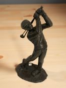 A bronzed resin figure of a golfer, height 26 cm.