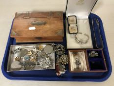 A group of costume jewellery including a moonstone bangle stamped 925, a further modernist ring,