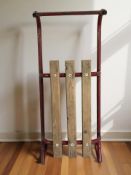 A vintage metal and pine sledge,