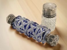 A blue glass flash cut double-ended scent bottle with silver caps, length 13 cm,