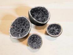 Four galena crystal geode specimens, largest 9.5 cm diameter.