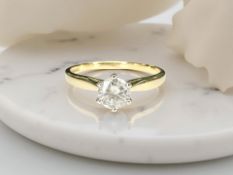 An 18ct yellow gold solitaire diamond ring, the brilliant-cut stone weighing approximately 0.