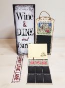 A group of modern metal and wooden signs.