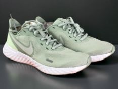 A pair of Nike women's Revolution 5 trainers, pistachio / volt, UK 5.