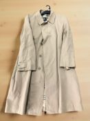 A Burberry mac/overcoat.