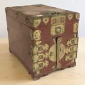 A Chinese red lacquered table box, with brass mounts, 34 cm x 24 cm x 29 cm.