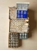 A large quantity of drinking glasses including lead crystal and etched examples.