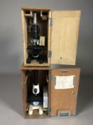 A Tecnar Swift microscope and a further SUI microscope, both in wooden boxes.