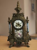 A continental gilt metal and porcelain mantel clock, height 40 cm.