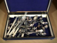 An oak canteen of EPNS cutlery.