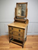 An Edwardian oak three drawer dressing chest, 58 cm W x 46 cm D x 146 cm H.